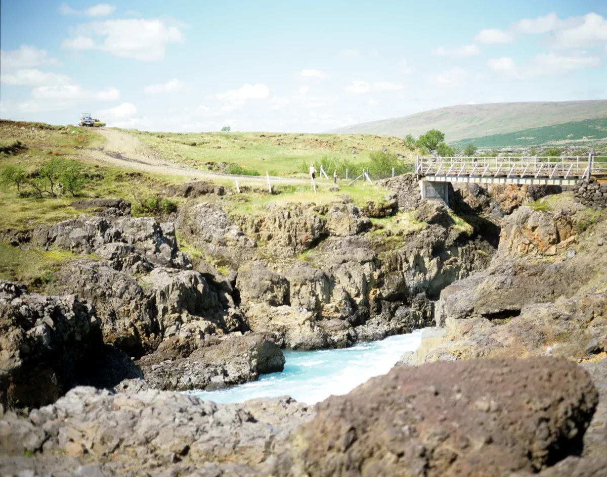 Rocky gorge and footbridge on the Ytri-Rangá river in South Iceland, the top river for salmon fishing in Iceland